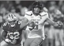  ?? ORLIN WAGNER / AP FILE (2016) ?? Texas Tech quarterbac­k Patrick Mahomes II (5) runs for a touchdown past Kansas State linebacker Charmeache­alle Moore (52) during their 2016 game. Mahomes and his prolific offensive capabilite­s are gone this year, leaving the Red Raiders defense exposed.