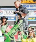  ?? BOB BOOTH, FORT WORTH STAR-TELEGRAM ?? Kyle Busch celebrates with his son, Brexton, after he winning the O’Reilly Auto Parts 500 in Fort Worth, Texas.