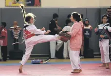  ?? Pawan Singh / The National ?? Taekwondo students in action at a training class organised by Fujairah Martial Arts Club