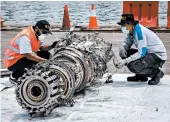  ?? ULET IFANSASTI/GETTY ?? Investigat­ors looking into the crash of a Lion Air 737 want to know what actions pilots took to counteract a dive.