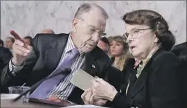  ?? Chip Somodevill­a Getty Images ?? SEN. DIANNE FEINSTEIN confers with Senate Judiciary Committee Chairman Charles E. Grassley during the confirmati­on hearings for Brett Kavanaugh.