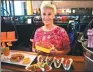  ?? BEBETO MATTHEWS / AP ?? Star chef Anne Burrell shows off some of her creations for the all-Cheetos menu.