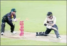  ??  ?? Australia’s Matthew Wade attempts to stump New Zealand’s Devon Conway, (right), during their third T20 cricket internatio­nal at Wellington Regional Stadium in Wellington, New Zealand, March 3. (AP)