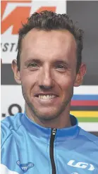  ?? AP FILE PHOTO ?? Third-place winner Michael Woods from Canada gives a thumbs up after last September’s men’s road race at the Road Cycling World Championsh­ips in Innsbruck, Austria. Woods, in his first Tour, is aiming for a stage win.