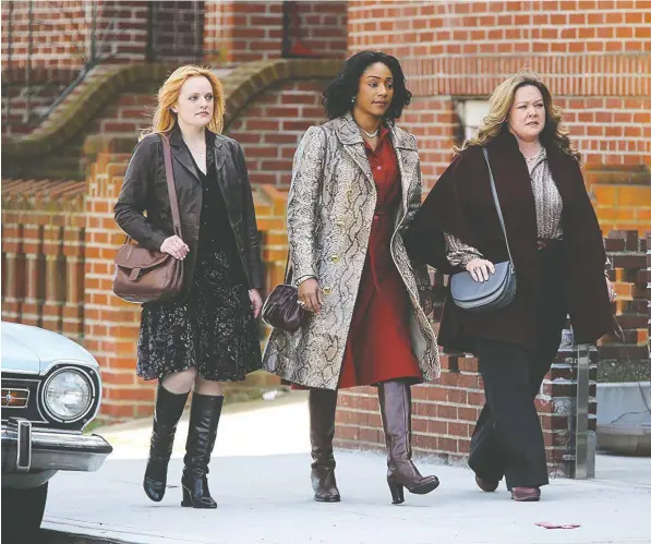  ?? — WARNER BROS. ?? Elisabeth Moss, Tiffany Haddish and Melissa McCarthy play characters married to members of the Irish Mafia in The Kitchen.