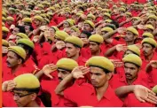  ?? — ASIAN AGE ?? Red Volunteers of the CPM take a salute during a meeting of the party in Kannur.