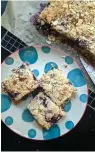  ?? Pittsburgh Post-Gazette/TNS ?? ■ A mix of blueberrie­s and chopped strawberry offer a taste of summer in these easy crumble bars.