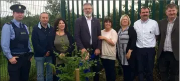  ??  ?? Gerry Adams with members of Muirhevnam­or Community Council.