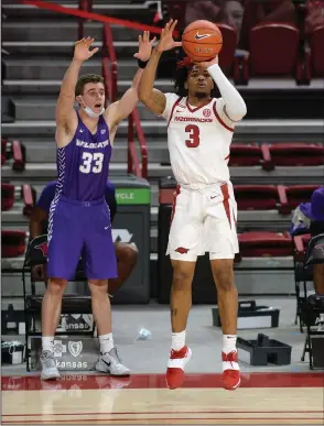  ?? NWA Democrat-Gazette/Andy Shupe ?? STRONG START: Arkansas guard Desi Sills (3) takes a 3-point shot during the first half of a Dec. 22 game against Abilene Christian in Bud Walton Arena in Fayettevil­le.