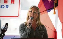  ?? Dustin Chambers / TNS ?? Marjorie Taylor Greene, whom President Donald Trump has called a “future Republican star,” on Tuesday won a vacant seat from an overwhelmi­ngly Republican district in Georgia.