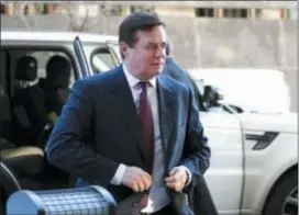  ?? SUSAN WALSH — THE ASSOCIATED PRESS FILE ?? In this file photo, former Trump campaign chairman Paul Manafort arrives at federal court in Washington. In a dramatic escalation of pressure and stakes, special counsel Robert Mueller filed additional criminal charges against Manafort and his business...