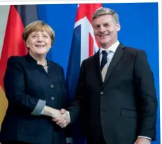  ??  ?? As PM with German Chancellor Angela Merkel earlier this year.