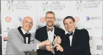  ?? ?? THAT WINNING FEELING Craig Gordon and Michael Frisby of Vuzion UK with editor of The News Mark Waldron at the Business Excellence Awards 2021