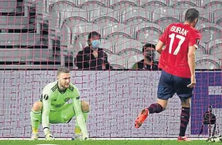  ??  ?? Scott Bain is helpless as Celtic concede for the tenth time in four games (above) while Allan Mcgregor has been as solid as ever for Rangers