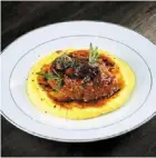  ??  ?? the ossobuco features tenderly pliant veal couched in a rich, flavourful stew with grilled onions and mashed potatoes.