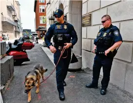  ?? (AFP) ?? US Department of Homeland Security officers patrol the federal court in Worcester, Massachuse­tts on Friday, where US airman Jack Teixeira was scheduled to appear