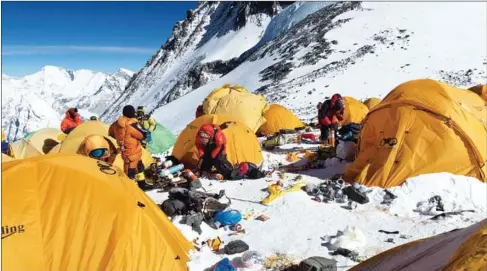  ?? DAMIAN BENEGAS/AFP ?? Discarded climbing equipment and rubbish scattered around Camp 4 of Mount Everest.
