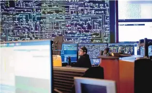  ?? CHANCEY BUSH/JOURNAL ?? Melvin Platero, transmissi­on operator, works in the control room at Public Service Company of New Mexico’s power operations center in the South Valley on Feb. 14. The center monitors the grid 24/7 to continuous­ly balance supply and demand.