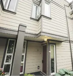  ??  ?? The exterior of a strata corporatio­n townhouse listed at $569,000, and located in North Vancouver. There is a descriptio­n of the property and an explanatio­n of what a strata corporatio­n is on the previous page.