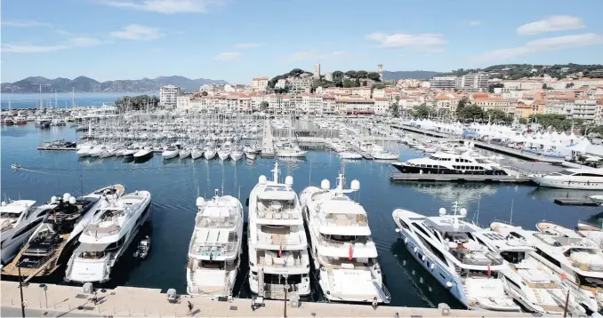  ?? Reuters ?? BOATS in the Port of Cannes are pictured before the start of the festival.
|