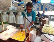  ?? ZACHARY SRNIS — THE MORNING JOURNAL ?? Gus Peskiris, a member of St. Nicholas Orthodox Church, prepares french fries for the Greek Festival on Sept. 6.