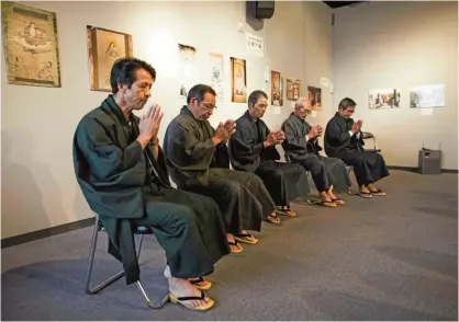  ??  ?? In this photo, Japanese ‘hidden Christians’ perform orasho prayers on Ikitsuki Island in Nagasaki prefecture.