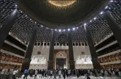  ?? ACHMAD IBRAHIM — THE ASSOCIATED PRESS FILE ?? Indonesian Muslims pray spaced apart as they practice social distancing during an evening prayer called “tarawih” marking the first eve of the holy fasting month of Ramadan at Istiqlal Mosque in Jakarta, Indonesia.