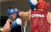  ?? PHOTO: KEVIN STENT/FAIRFAX NZ ?? New Zealand heavyweigh­t Joseph Parker competes in a amateur fight against a boxer from China in 2011.