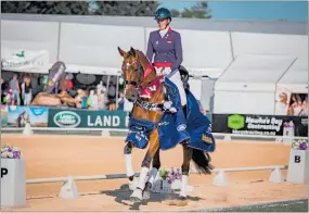  ?? PICTURE / SUPPLIED ?? Kerikeri’s Julie Flintoff completes a lap of honour on Belladonna after winning the Level 7 title at the Horse of the Year championsh­ip at the Hawke’s Bay Showground in Hastings last weekend.