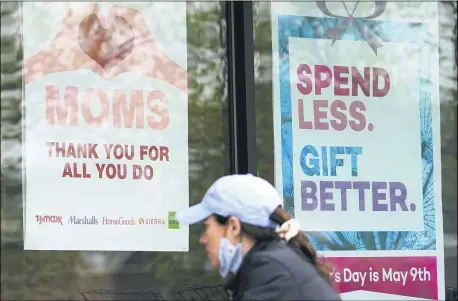  ?? THE ASSOCIATED PRESS ?? Signs about Mother’s Day are displayed May 8at a home decor department store in Northbrook, Ill.