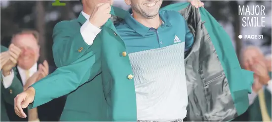  ?? Picture: Getty Images ?? Danny Willett of England presents Spaniard Sergio Garcia with the green jacket after Garcia won the Masters in a play-off at Augusta National Golf Club in Georgia on Sunday.