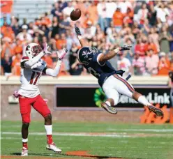 ?? Associated Press ?? n Virginia free safety Quin Blanding (3) disrupts a pass intended for Louisville wide receiver James Quick (17) during the first half of an NCAA college football game Oct. 29, 2016, in Charlottes­ville, Va. Virginia is coming off a 3-9 season and...