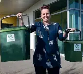  ?? CATHERINE GROENESTEI­N/STUFF ?? Rebecca Martin, STDC environmen­t and sustainabi­lity manager, with two of the new composting bins.