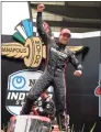 ?? Stacy Revere / Getty Images ?? Will Power of Australia, driver of the No. 12 Verizon 5G Team Penske Chevrolet, celebrates in victory lane after winning the NTT IndyCar Series Grand Prix at Indianapol­is Motor Speedway on Sunday in Indianapol­is.