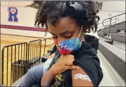  ?? LAURA UNGAR — THE ASSOCIATED PRESS ?? Solome Walker, 9, got her first Pfizer COVID-19shot at a vaccinatio­n clinic for young students at Ramsey Middle School on Nov. 13 in Louisville, Ky.