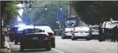  ?? MIKE KROPF/RICHMOND TIMES-DISPATCH ?? CARS AND POLICE GATHER AROUND Altria Theater, the site of a shooting at the Huguenot High School graduation Tuesday in Richmond, Va.