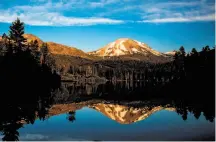  ?? Max Whittaker / Special to The Chronicle 2016 ?? Mount Lassen looms over Manzanita Lake in Shasta County, one of the eight counties using the name “Upstate CA.”