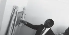  ??  ?? VP Emmerson Mnangagwa reads the plaque on the refurbishe­d ward at Masvingo General Hospital during a tour of the institutio­n yesterday