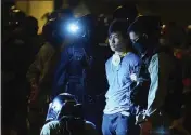  ?? VINCENT YU — THE ASSOCIATED PRESS ?? Riot police detain a protestor after he tried to escape from Hong Kong Polytechni­c University in Hong Kong on Tuesday.