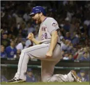  ?? DAVID J. PHILLIP/ASSOCIATED PRESS ?? The Mets’ Daniel Murphy reacts after scoring during the seventh inning of Game 3 of the National League championsh­ip series against the Cubs on Oct. 20 in Chicago. Murphy scored from third on a ball hit by Lucas Duda. The Mets won, 5-2, and lead the...