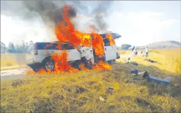  ??  ?? THE JOURNEY THAT NEVER WAS . . . The two vehicles, a Honda CRV and Nissan Caravan are engulfed in flames on impact at the 60km peg along Mvurwi-Centenary Road on Monday