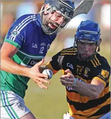  ??  ?? Michael Doyle (Glynn-Barntown) grabs the ball a split second before Rory Higgins (Rathnure) in the Pettitt’s SHC game in New Ross.