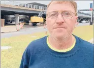  ?? KENNETH R. GOSSELIN/HARTFORD COURANT ?? Robert Bullock, a constructi­on worker on a job at Bradley Internatio­nal Airport, rushed to aid workers trapped inside a shed near the site of a deadly B-17 bomber crash Wednesday.