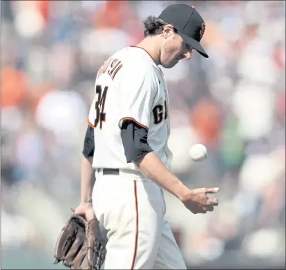  ?? JED JACOBSOHN — THE ASSOCIATED PRESS ?? Giants pitcher Kevin Gausman, who lost his bid for a no-hitter in the seventh inning, reacts Monday to a triple by St. Louis’ Matt Carpenter.