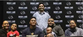 ??  ?? Ridgeland senior defensive tackle Judah Thomas signed papers to continue his football career at Reinhardt University last week. Also on hand for the signing ceremony was Keyona Thomas, A.J. Ramsay, Jr., Anthony Ramsay, Aaliyah Thomas and (standing) Gabriel Acosta.