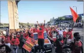  ??  ?? JOVIAL: EFF supporters marched around the Durban Station yesterday ahead of the party’s celebratio­ns today.