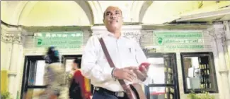  ?? ANSHUMAN POYREKAR/HT PHOTO ?? Vishnu Zende still works at Chhatrapat­i Shivaji Maharaj Terminus (CSMT), but is now a railway guard.