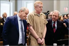  ?? JOSHUA BOUCHER — THE STATE VIA AP ?? Alex Murdaugh speaks with his legal team before he is sentenced to two consecutiv­e life sentences for the murder of his wife and son by Judge Clifton Newman at the Colleton County Courthouse on Friday, March 3, 2023 in in Walterboro, S.C.