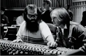  ??  ?? RUNNING DOWN A DREAM Clockwise from top: Rubin and Petty in the studio during the Wildflower­s sessions, 1993; composer Michael Kamen going over string arrangemen­ts in 1994; Campbell recording a guitar part that same year.