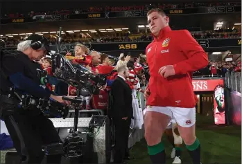  ??  ?? Tadhg Furlong runs out to make his full Test Lions debut against New Zealand in Auckland.